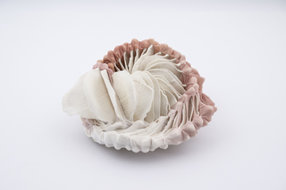 Enclosed, 2025, Handshaped porcelain elements, dyed nylon textile, tied, 18 x 20 x 9 cm, Photo Thor Brødreskift